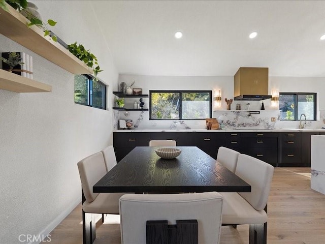 dining room featuring a wealth of natural light, recessed lighting, and light wood-style floors