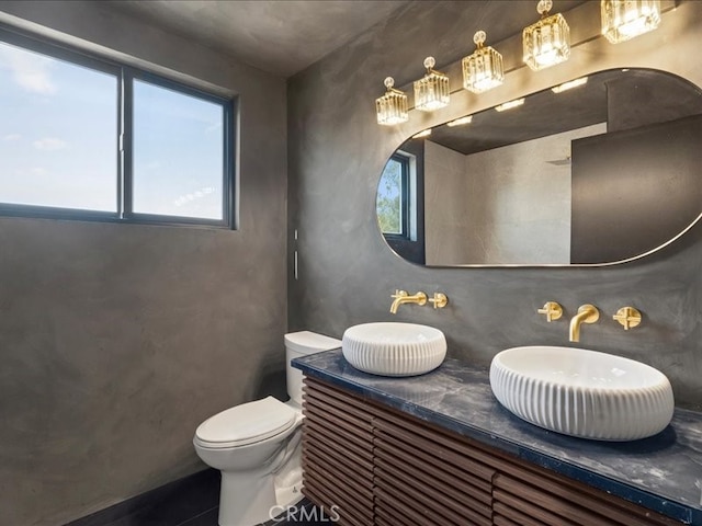 bathroom with toilet and vanity