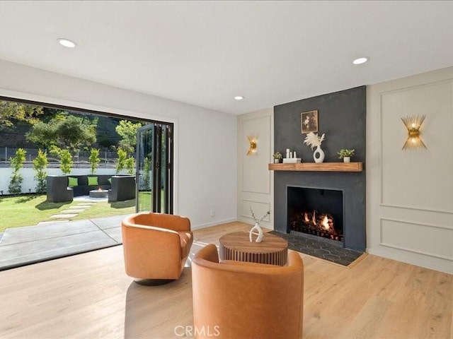 214 Maynard Ave, Newbury Park, CA 91320 - living room with a large fireplace, wood finished floors, recessed lighting, and baseboards