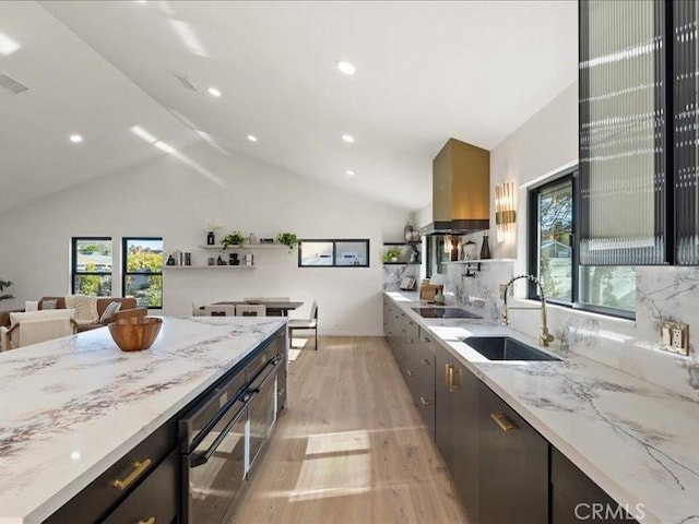 214 Maynard Ave, Newbury Park, CA 91320 - kitchen featuring a sink, black electric stovetop, light wood finished floors, ventilation hood, and lofted ceiling
