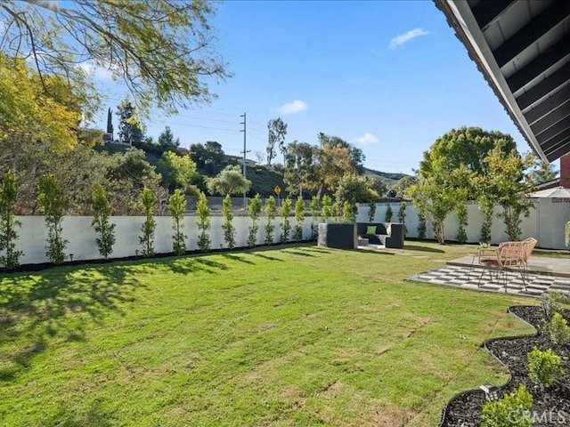 view of yard with a patio area and fence