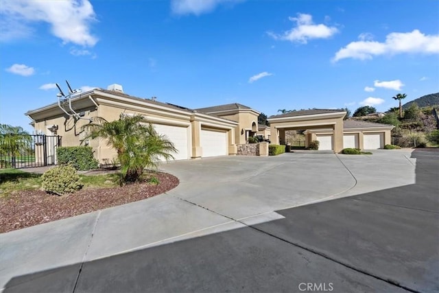 4195 Robby Cir, Corona, CA 92881 - view of front of property featuring stucco siding, a garage, and concrete driveway