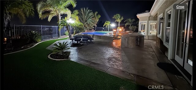 4195 Robby Cir, Corona, CA 92881 - patio at twilight with a patio, a hot tub, and a fenced backyard