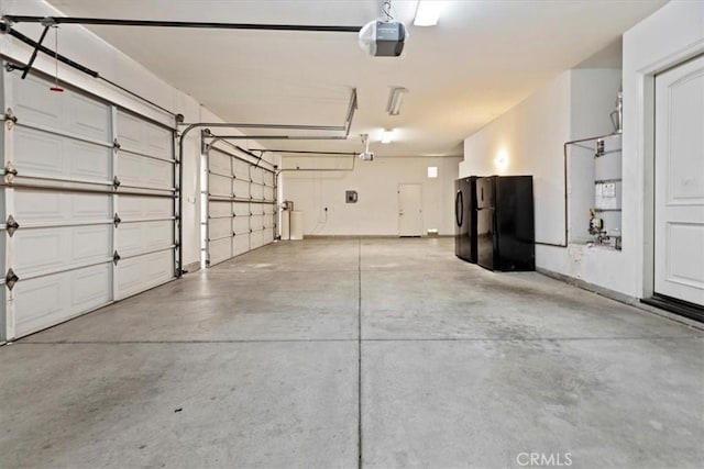 4195 Robby Cir, Corona, CA 92881 - garage with freestanding refrigerator, a garage door opener, and water heater