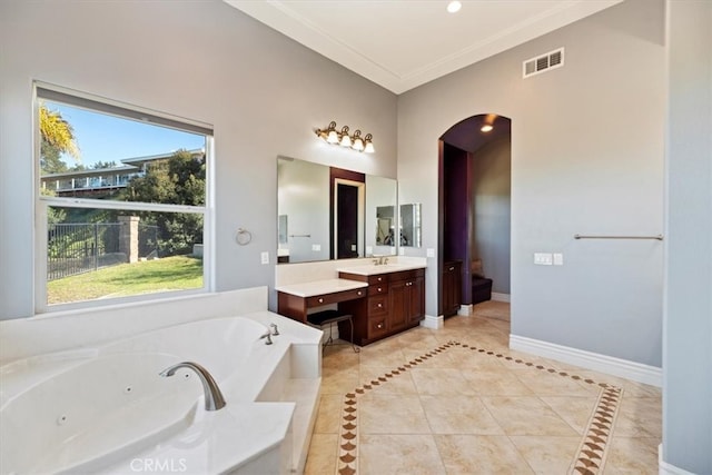 4195 Robby Cir, Corona, CA 92881 - bathroom with vanity, a tub with jets, tile patterned flooring, baseboards, and crown molding