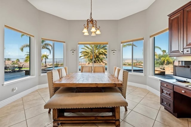 4195 Robby Cir, Corona, CA 92881 - dining space featuring a chandelier, light tile patterned floors, and baseboards