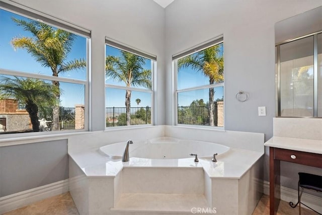 4195 Robby Cir, Corona, CA 92881 - bathroom with a whirlpool tub, baseboards, vanity, and tile patterned floors