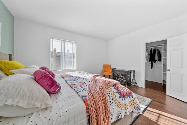 13325 Via Constanza Unit 2, San Diego, CA 92129 - bedroom featuring wood finished floors, a closet, and a walk in closet