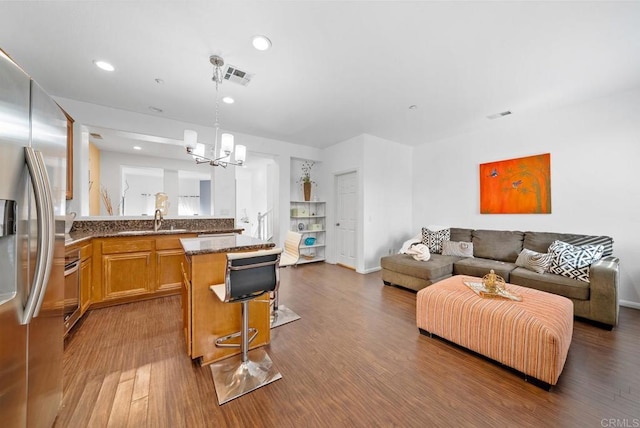 13325 Via Constanza Unit 2, San Diego, CA 92129 - living area with wood finished floors, a chandelier, and recessed lighting