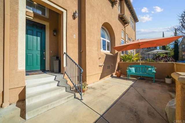 13325 Via Constanza Unit 2, San Diego, CA 92129 - doorway to property with stucco siding and a patio