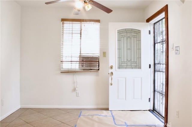 323 E Hanna St, Colton, CA 92324 - foyer with tile patterned floors, a wealth of natural light, baseboards, and a ceiling fan