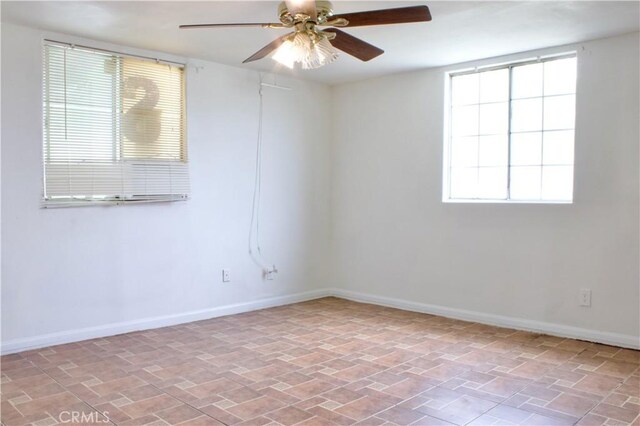 323 E Hanna St, Colton, CA 92324 - unfurnished room with ceiling fan, baseboards, and a healthy amount of sunlight