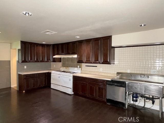 9286 San Benito Ave, Gerber, CA 96035 - kitchen with tasteful backsplash, stainless steel dishwasher, light countertops, and white gas range oven