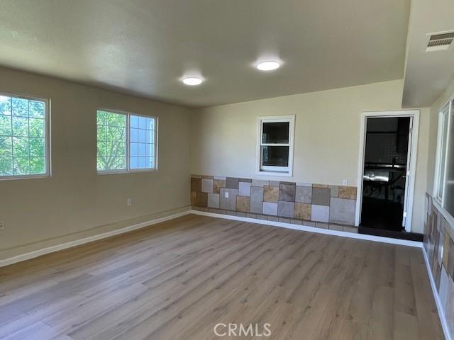 9286 San Benito Ave, Gerber, CA 96035 - interior space with visible vents, baseboards, and wood finished floors