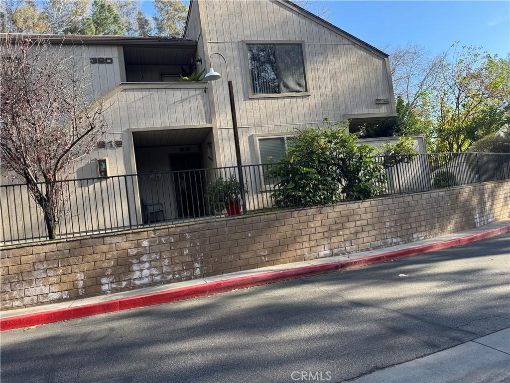 600 Central Ave Unit 319, Riverside, CA 92507 - view of side of home featuring fence