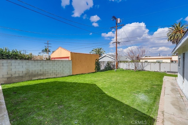 view of yard with a fenced backyard
