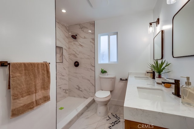 full bath featuring a sink, tiled shower, toilet, and marble finish floor