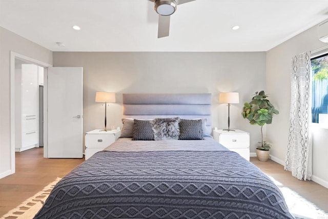 bedroom with recessed lighting, baseboards, and light wood-type flooring