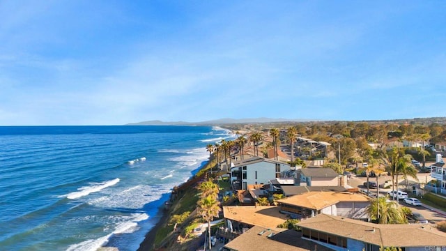 aerial view featuring a view of the beach and a water view