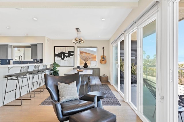 1631 Neptune Ave, Encinitas, CA 92024 - living area with light wood-style flooring, a chandelier, and recessed lighting