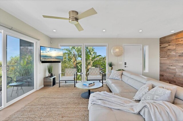 1631 Neptune Ave, Encinitas, CA 92024 - living area with wood walls, recessed lighting, and ceiling fan