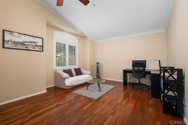office space featuring baseboards, vaulted ceiling, crown molding, ceiling fan, and wood finished floors