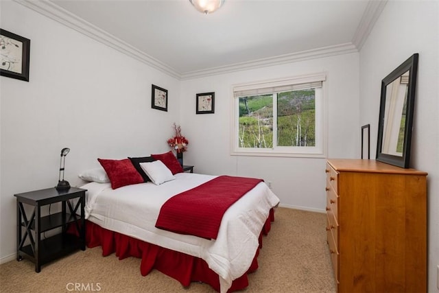 bedroom featuring carpet flooring, baseboards, and ornamental molding