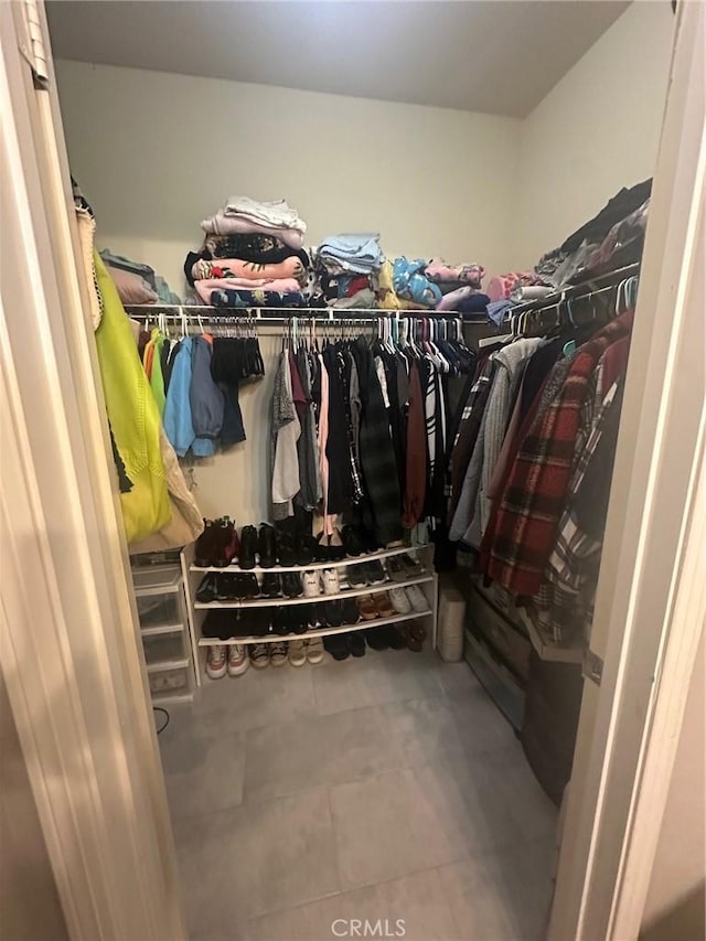 spacious closet with tile patterned flooring