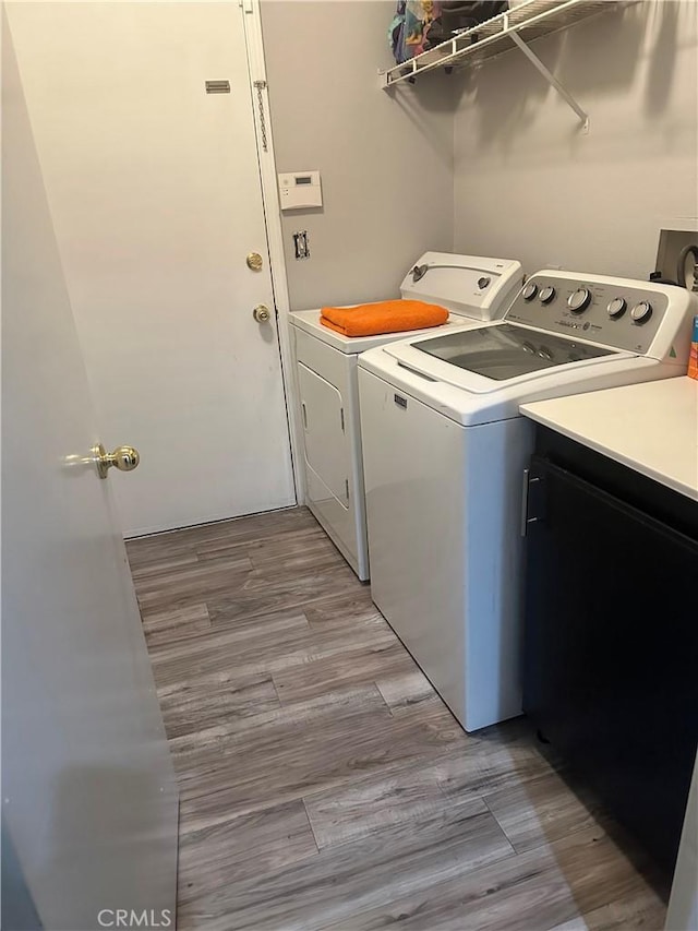 laundry room with cabinet space and independent washer and dryer