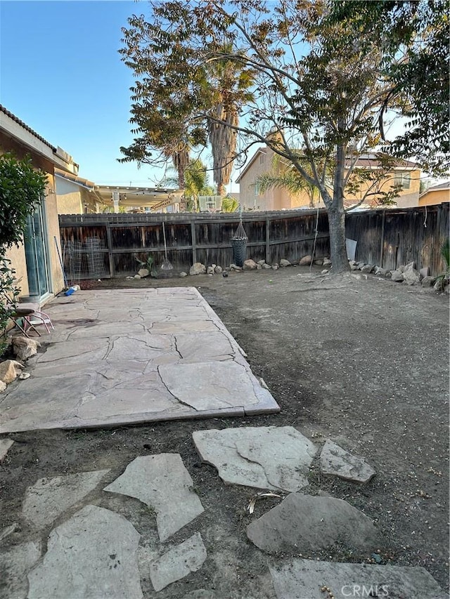 view of yard featuring a fenced backyard and a patio area