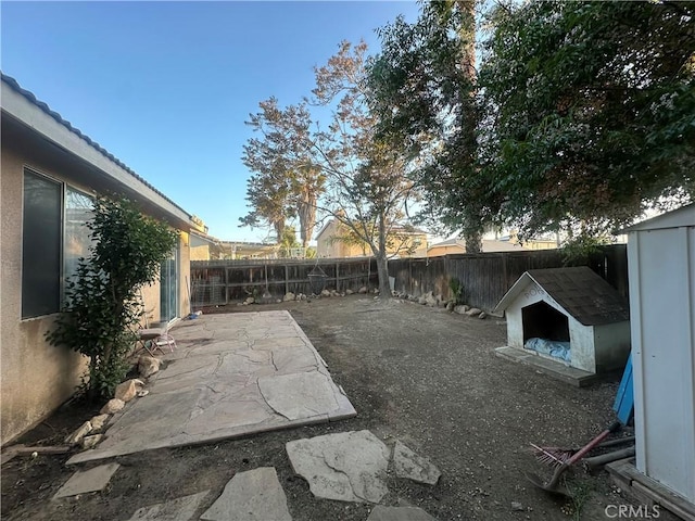 view of yard featuring a patio and a fenced backyard