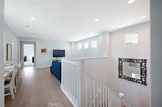 135 Bosal, Irvine, CA 92618 - corridor with an upstairs landing, plenty of natural light, hardwood / wood-style floors, and recessed lighting