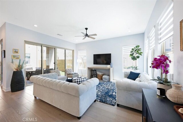 135 Bosal, Irvine, CA 92618 - living area featuring ceiling fan, healthy amount of natural light, light wood-style floors, and recessed lighting