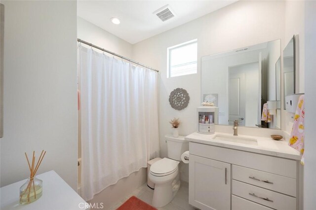 135 Bosal, Irvine, CA 92618 - bathroom featuring vanity, toilet, shower / bath combo with shower curtain, and tile patterned flooring