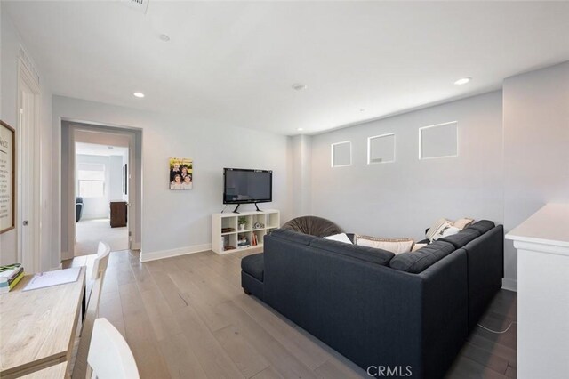 135 Bosal, Irvine, CA 92618 - living area with wood finished floors, recessed lighting, and baseboards