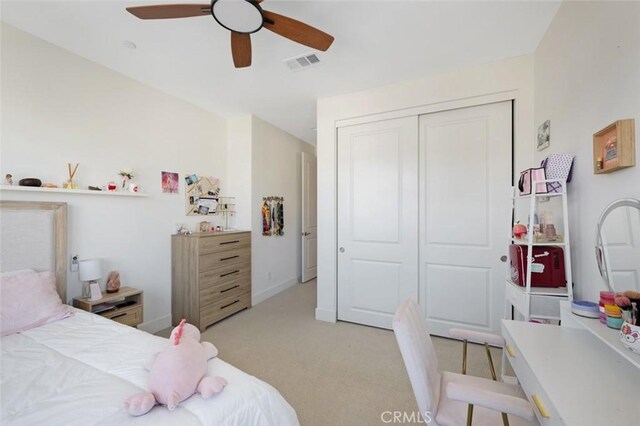 135 Bosal, Irvine, CA 92618 - bedroom featuring light colored carpet, a closet, a ceiling fan, and baseboards