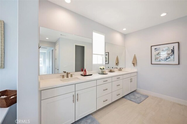 135 Bosal, Irvine, CA 92618 - full bathroom with double vanity, recessed lighting, and baseboards
