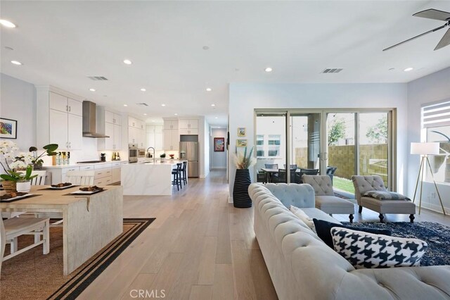 135 Bosal, Irvine, CA 92618 - living room featuring light wood-type flooring, a ceiling fan, and recessed lighting