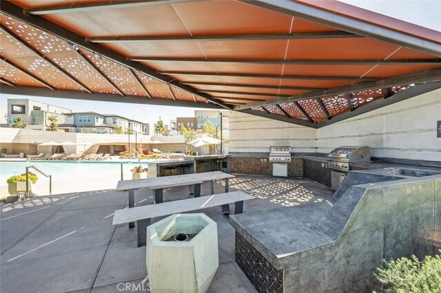 135 Bosal, Irvine, CA 92618 - view of patio / terrace featuring a community pool and outdoor dining space