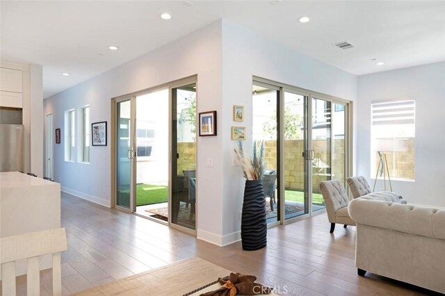 135 Bosal, Irvine, CA 92618 - living area with hardwood / wood-style floors, baseboards, and recessed lighting