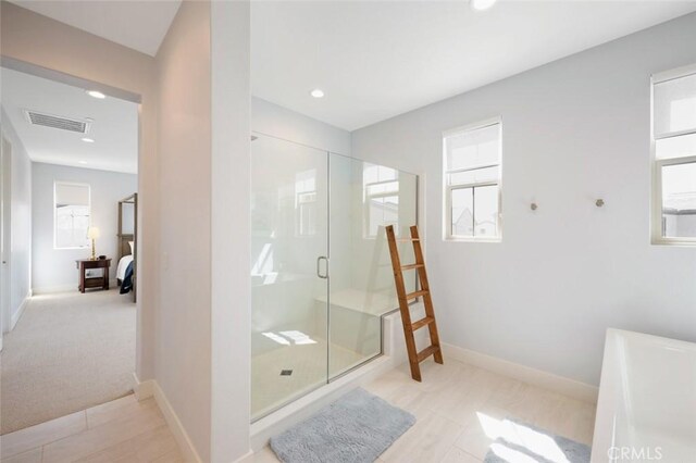 135 Bosal, Irvine, CA 92618 - bathroom with a shower stall, connected bathroom, recessed lighting, healthy amount of natural light, and baseboards