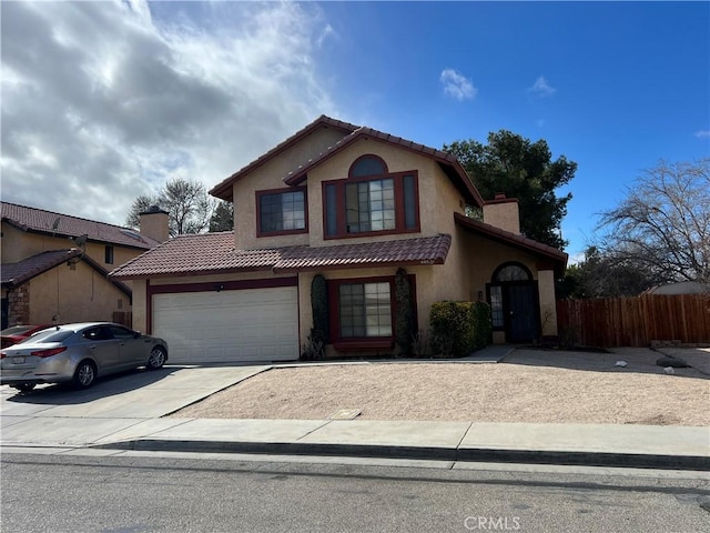 44827 Rock Island Dr, Lancaster, CA 93535 - view of front facade with fence, a tiled roof, concrete driveway, stucco siding, and a chimney