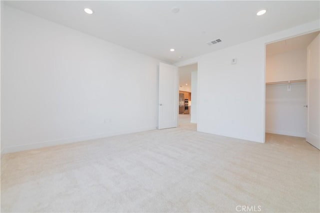 1406 Rivington, Irvine, CA 92612 - unfurnished bedroom featuring baseboards, visible vents, recessed lighting, a spacious closet, and light carpet