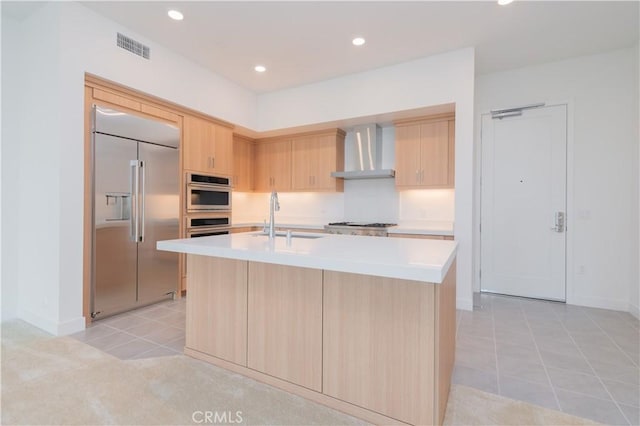 1406 Rivington, Irvine, CA 92612 - kitchen featuring light brown cabinetry, a sink, wall chimney range hood, stainless steel appliances, and light countertops