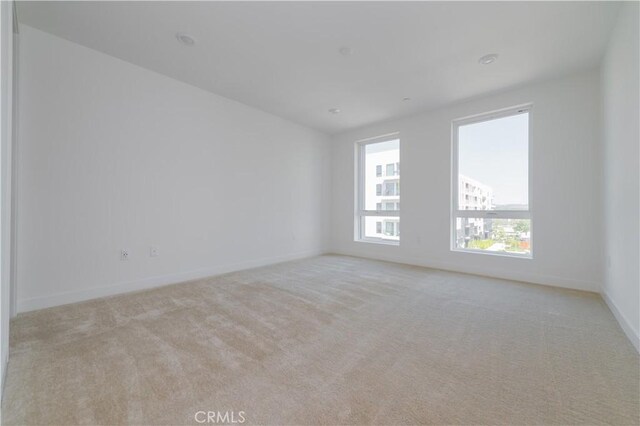 1406 Rivington, Irvine, CA 92612 - unfurnished room with baseboards and light carpet