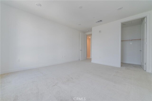 1406 Rivington, Irvine, CA 92612 - unfurnished bedroom featuring visible vents, baseboards, attic access, a closet, and light colored carpet