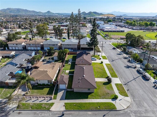 drone / aerial view with a residential view and a mountain view