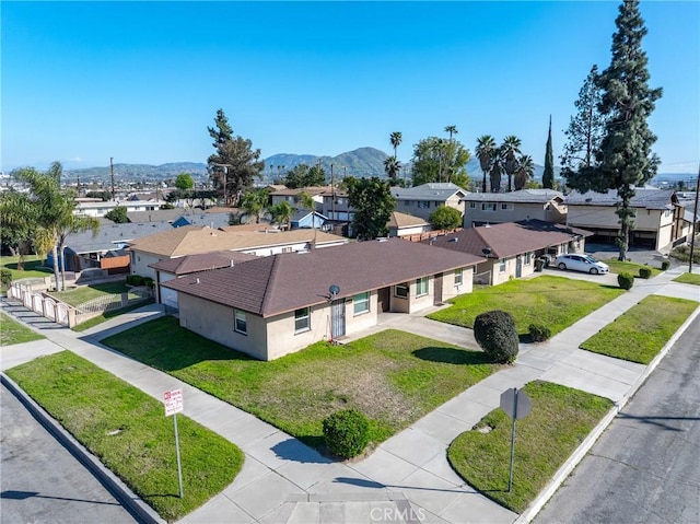 birds eye view of property with a residential view and a mountain view