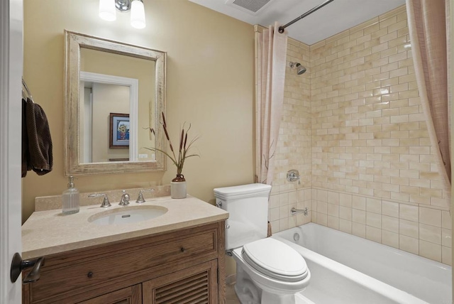 full bath featuring visible vents, shower / bath combo with shower curtain, toilet, and vanity