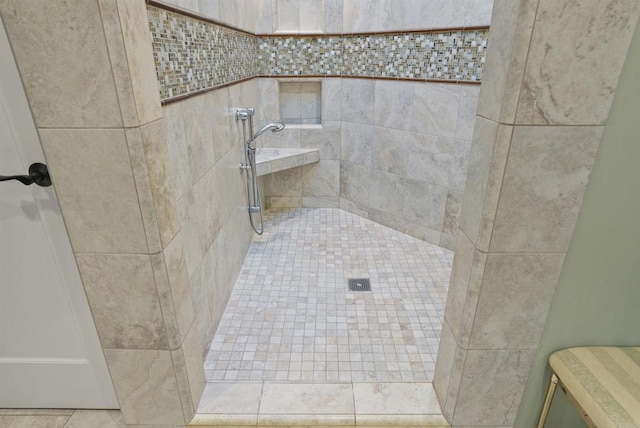 bathroom featuring tiled shower